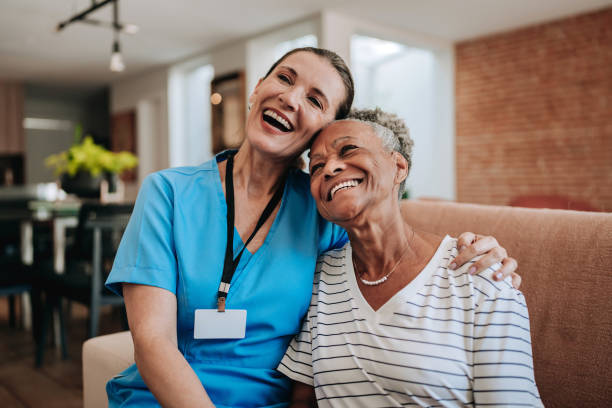 Professional caregiver assisting senior