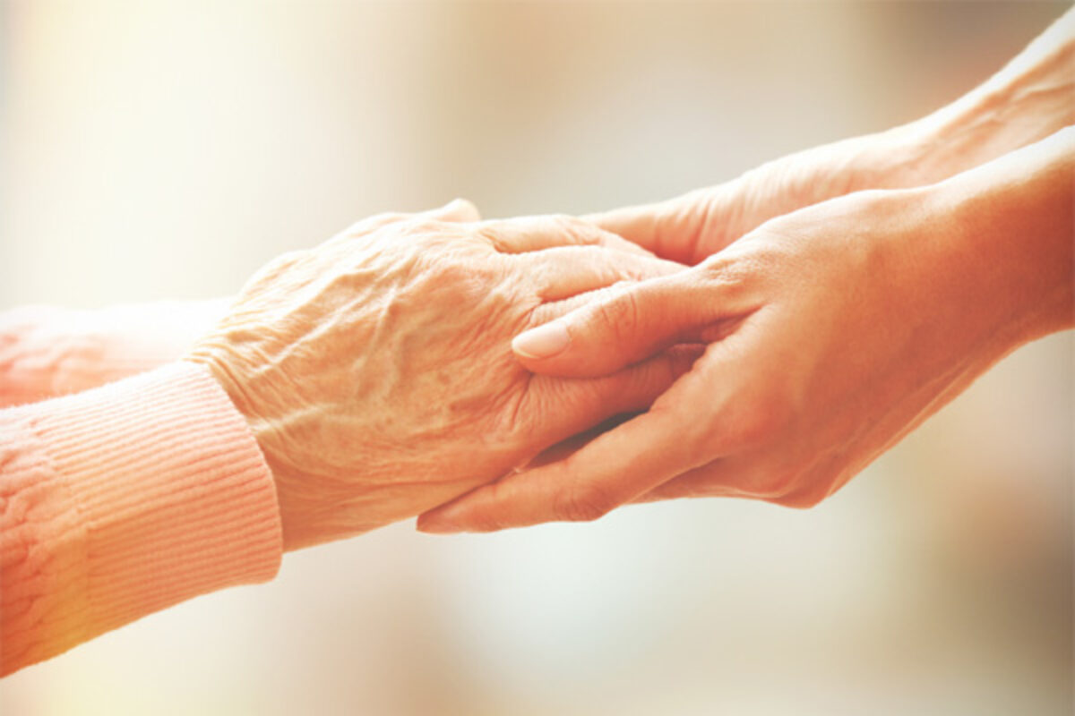 Compassionate support holding hands