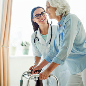 Professional caregiver assisting senior